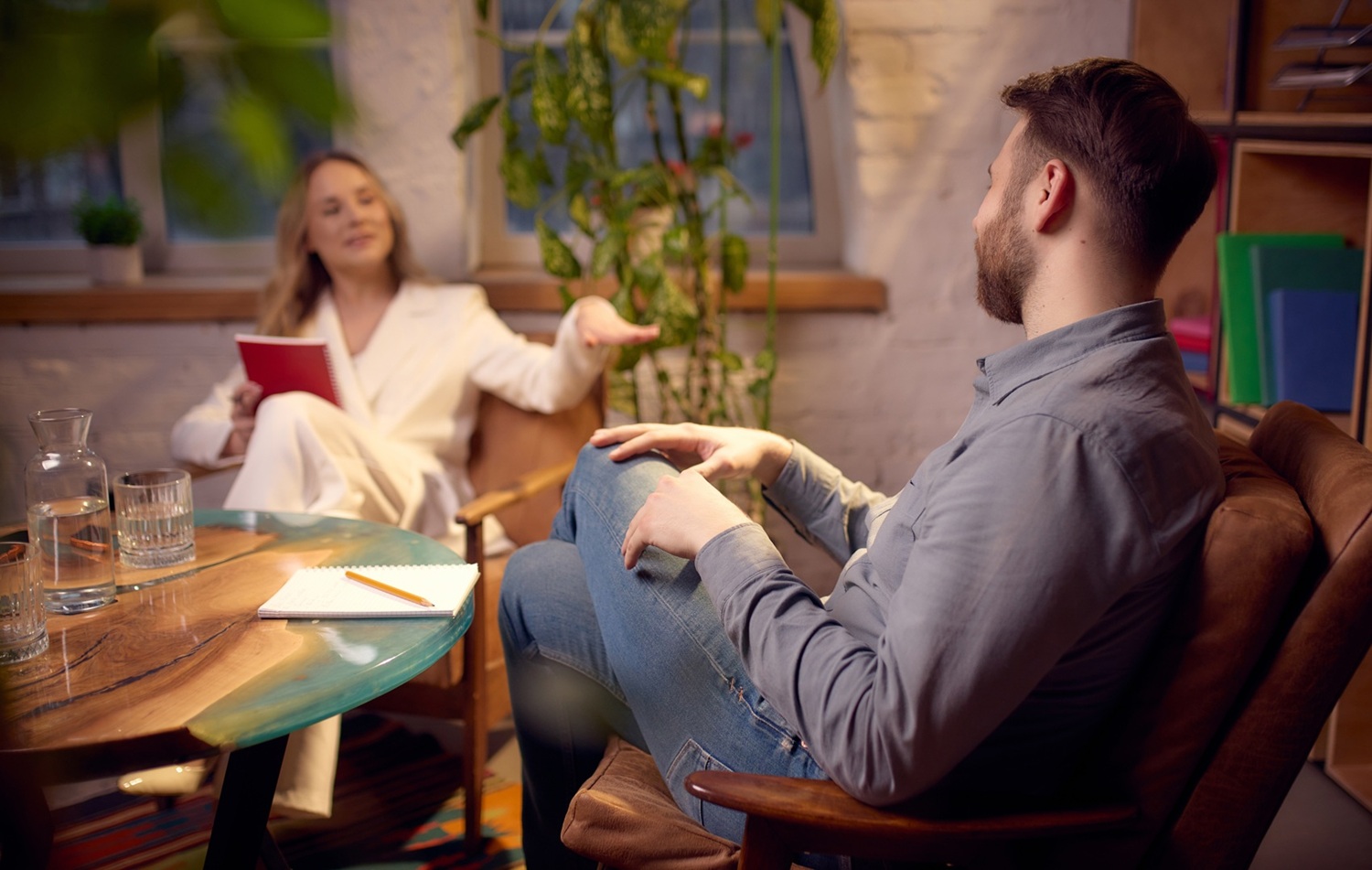 A client speaking with a coach about mental health difficulties
